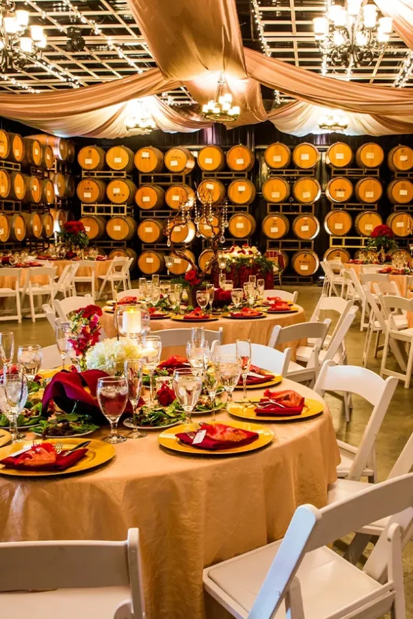 Wine barrel room reception setup with banquet tables at Mount Palomar Winery in Temecula
